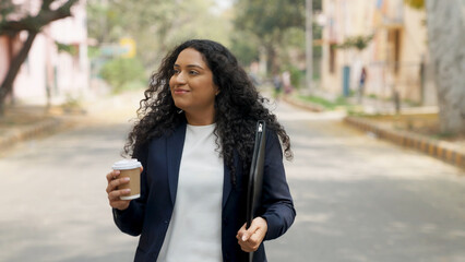 Happy Indian Businesswoman Dancing While Walking