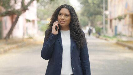 Happy Indian Businesswoman Talking on Phone