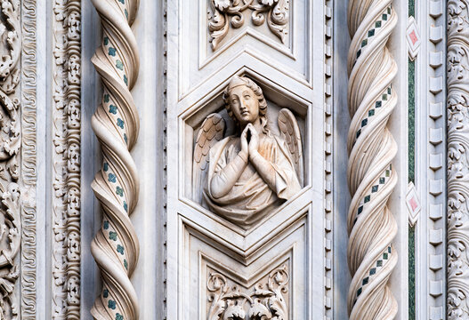 high relief of an angel detail of the facade of the cathedral Santa Maria del Fiore in Florence