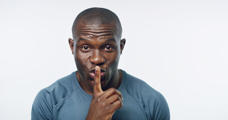 Workout, portrait and black man with fitness secret for health, wellness and mockup in studio space. Privacy, gossip and personal trainer with advice, confidential exercise tips and white background