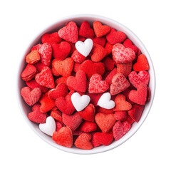 A bowl filled with various red and white heart-shaped candies.