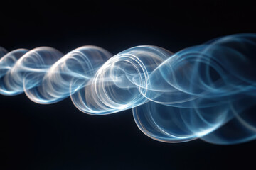 Obraz premium Abstract swirling blue smoke patterns on a transparent background, creating a dynamic and ethereal visual effect.