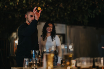 Two friends are engaged in a cheerful beer pong game outdoors during the evening, sharing laughter and camaraderie in a lively, relaxed atmosphere.