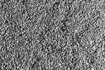 Seamless industrial background texture of gray gravel, top view
