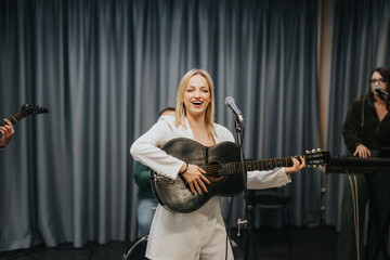 Musicians come together to rehearse music in a professional studio, featuring vibrant energy and creativity.