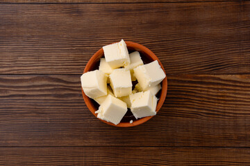 Butter that adds flavor to meals and is for breakfast on a wooden background