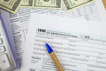 Obraz premium us tax forms 1040. For 2023, business tax time concept.