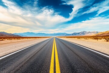 Naklejka premium A long empty road stretching through a desert landscape.