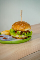 Delectable Burger with Thick Patty, Melted Cheese, and Fresh Greens Stealing the Show