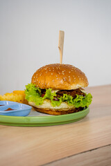 Delectable Burger with Thick Patty, Melted Cheese, and Fresh Greens Stealing the Show