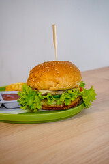 Delectable Burger with Thick Patty, Melted Cheese, and Fresh Greens Stealing the Show
