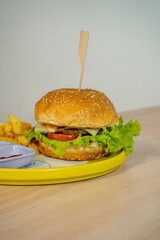 Delectable Burger with Thick Patty, Melted Cheese, and Fresh Greens Stealing the Show