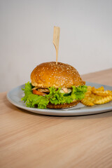Delectable Burger with Thick Patty, Melted Cheese, and Fresh Greens Stealing the Show