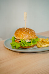 Delectable Burger with Thick Patty, Melted Cheese, and Fresh Greens Stealing the Show