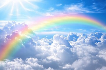 Scenic view of double rainbow and clouds . A vibrant rainbow arcs across a clear blue sky, showcasing a spectrum of colors against the backdrop of fluffy clouds.