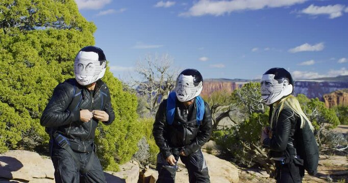 Gang with helmets distracted by something then running away with parachutes on