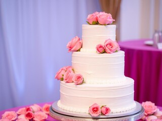 Three tier pink wedding cake decorated with roses perfect for wedding invitations, baking promotions, and romantic event advertising, event, dessert, tiered
