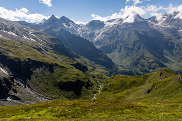 The Grossglockner mountain range with snow on the peaks and a blue sky