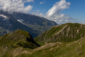 The Grossglockner mountain range with snow on the peaks and a blue sky