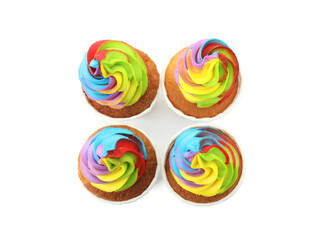 Obraz premium Tasty cupcakes with colorful cream isolated on white, top view