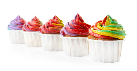Delicious cupcakes with colorful cream isolated on white