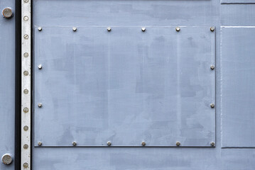 close up of Metal surface with rivets, Rivets on gray metal.
