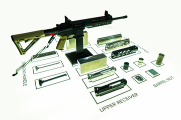 Machine guns, pistols in disassembled form on a white background