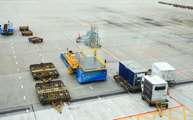 Ground support equipment, Baggage Tug( baggage dolly transport ) standby for services in Apron near...