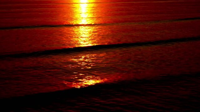 This stunning high-resolution video captures the Sun up close, showing intense reds, oranges and yellows. The Sun appears as a large sphere in the dark sky, with the lower part 