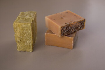 Bar soap of different colors on a uniform background