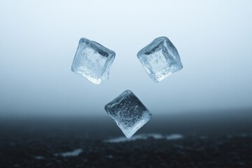 Obraz premium three ice cubes floating in mid-air against a misty background