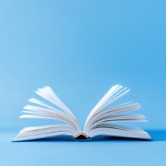 Obraz premium open book on blue background