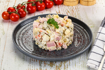 Russian traditional Olivier salad with sausages