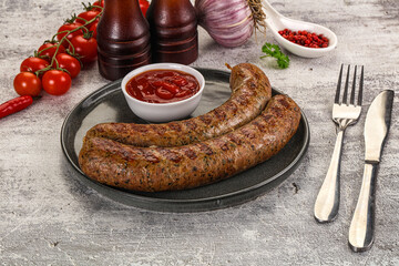 Grilled beef sausages with sauce