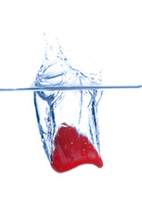 Red heart falls with a splash into  water. Valentines day card