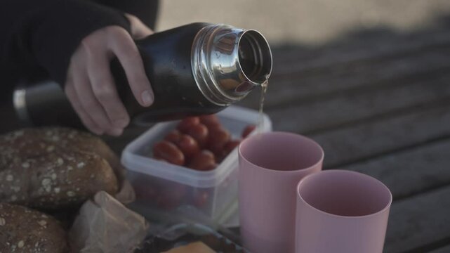 Cozy Outdoor Picnic with Warm Tea