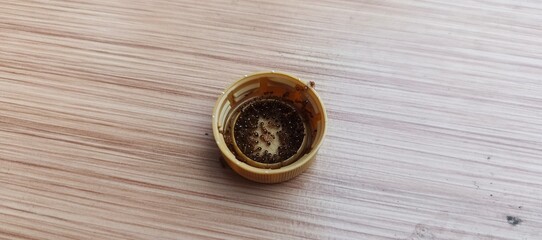 Ants Swarming a Bottle Cap with Sweet Liquid