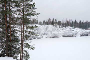 Winter in the park. Karelia Ruskeala Nature Reserve in winter. It is snowing in the forest.