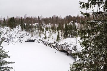 Winter in the park. Karelia Ruskeala Nature Reserve in winter. It is snowing in the forest.