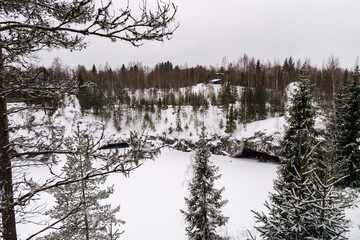 Winter in the park. Karelia Ruskeala Nature Reserve in winter. It is snowing in the forest.
