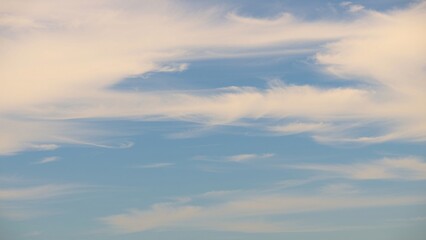 Serene Sky Soft White Clouds Drifting Across a Pale Blue Heaven
