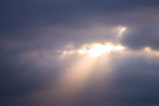 Sunlight coming from a dark sky - Powered by Adobe