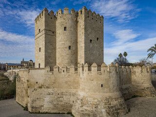 View of Calahorra tower a fortified gate in the historic center of Córdoba, Spain. The edifice is of Islamic origin guarding the Roman bridge