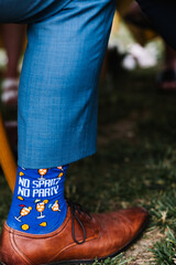 Quirky Blue Socks with 'No Spritz, No Party' Message and Leather Shoes