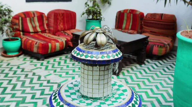 Traditional riyad internal yard with small fountain in Marakkesh Morocco