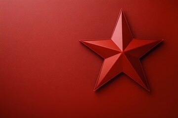 Red star sculpture against a vibrant red background with geometric design elements