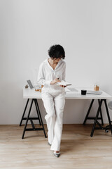 person writing on notebook