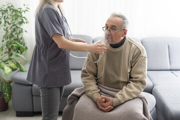 Elderly Senior Man nursing care wear oxygen inhaler device for helping breath respiratory. Oxygen...