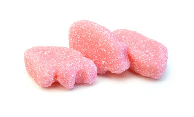 Gummy pigs shaped cutter, isolated in glass bowl on white background