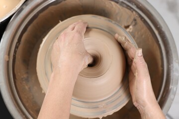 Hobby and craft. Woman making pottery indoors, above view